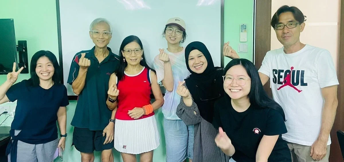 Students and their teacher after a Korean class